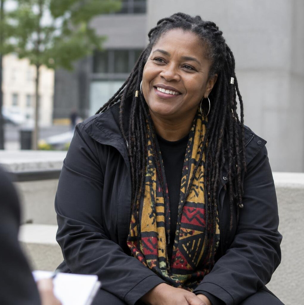 Portrait of a woman being interviewed outdoors